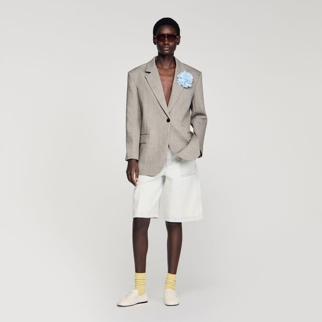 Veste en laine &agrave; carreaux et broche