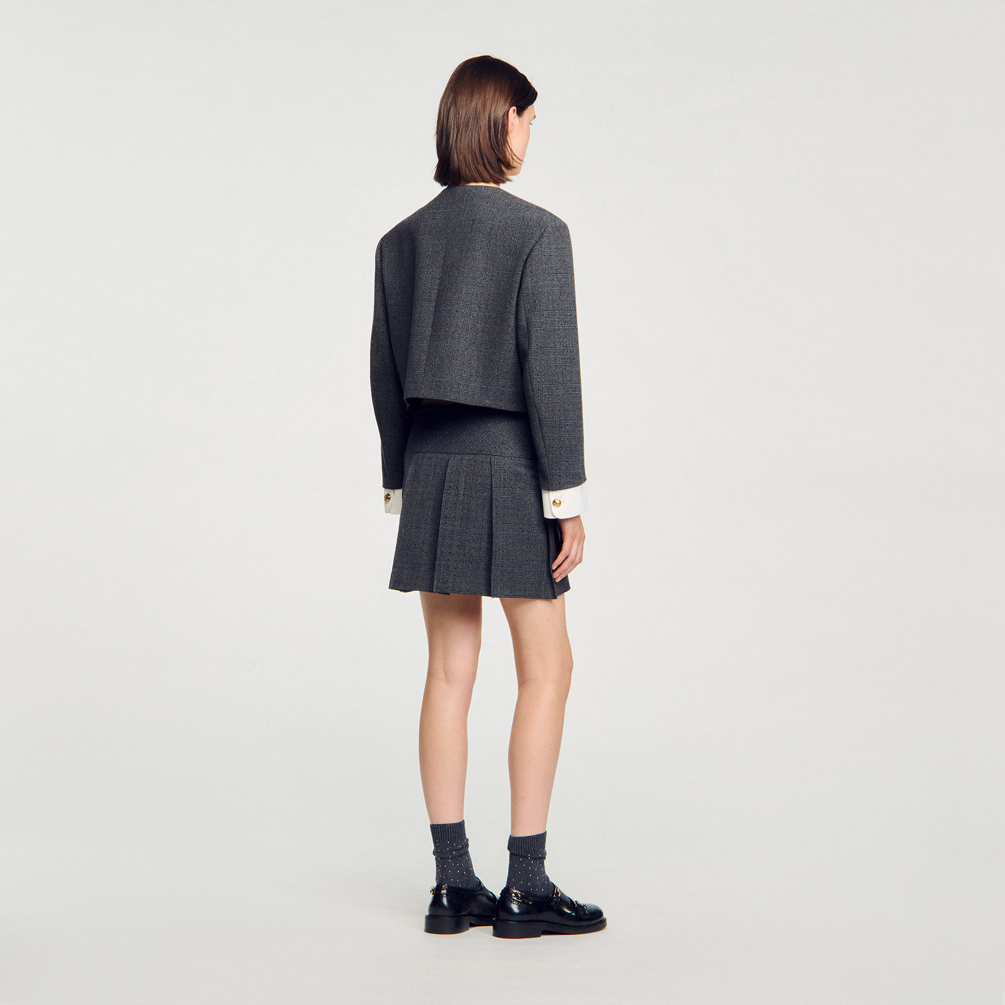 Jupe courte de tailleur strassée