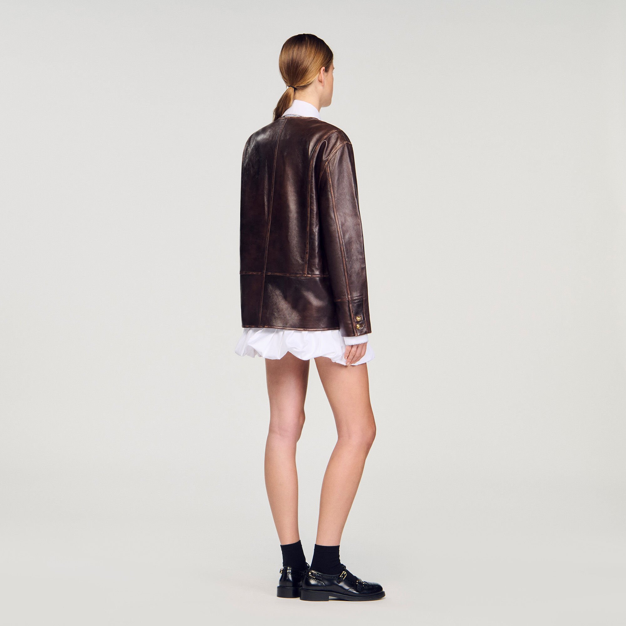 Blouson long en cuir vieilli