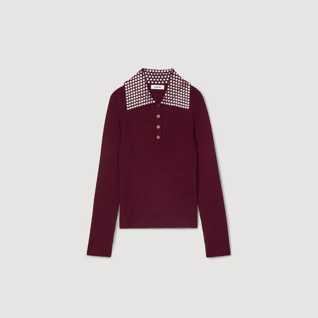 Pull à col orné de pastilles