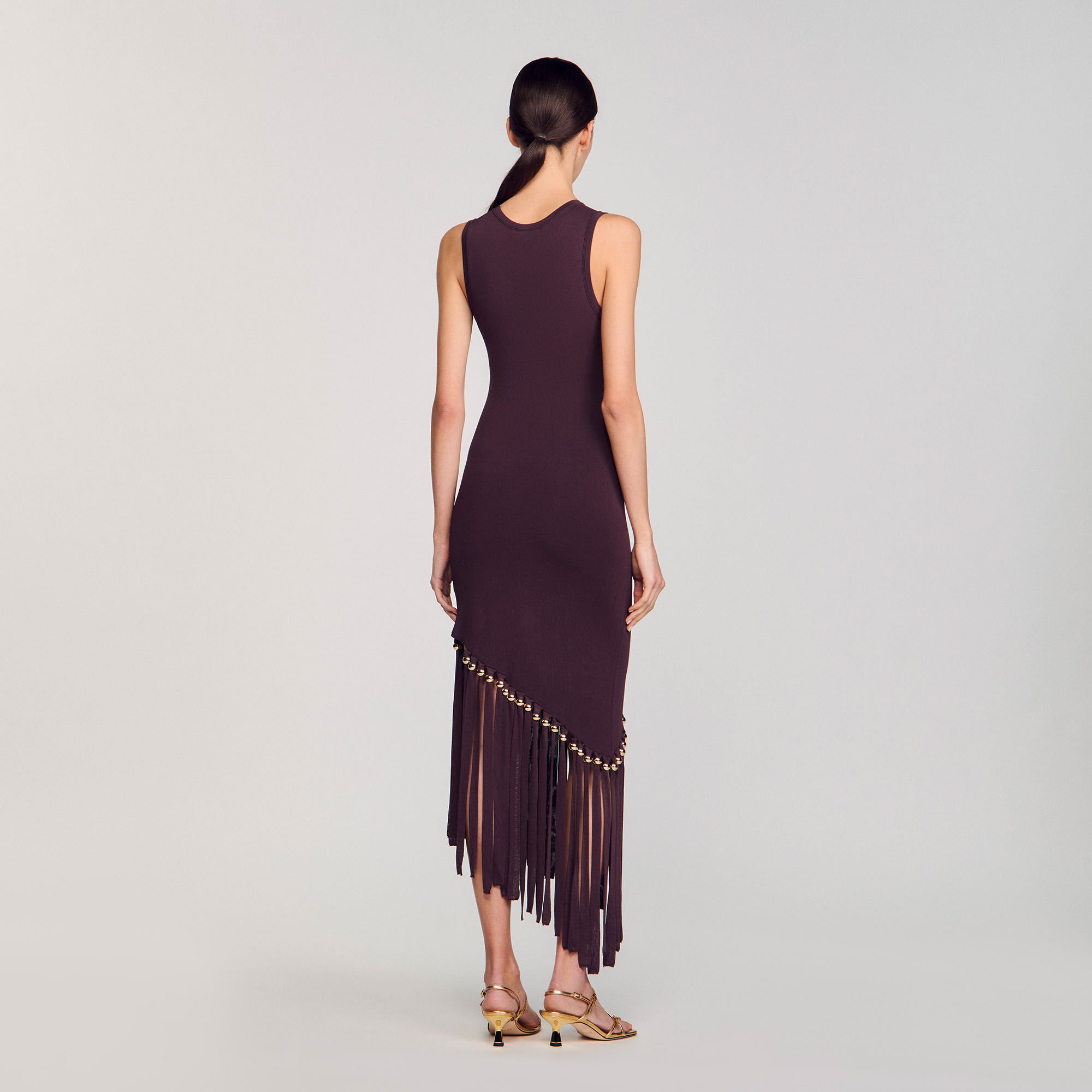 Robe longue frangée et perlée