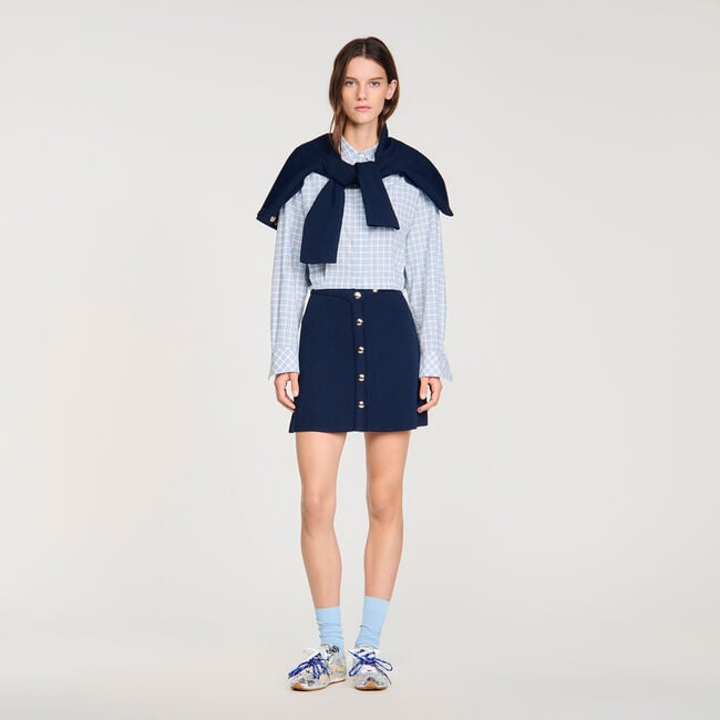 Jupe courte c&ocirc;tel&eacute;e &agrave; pressions