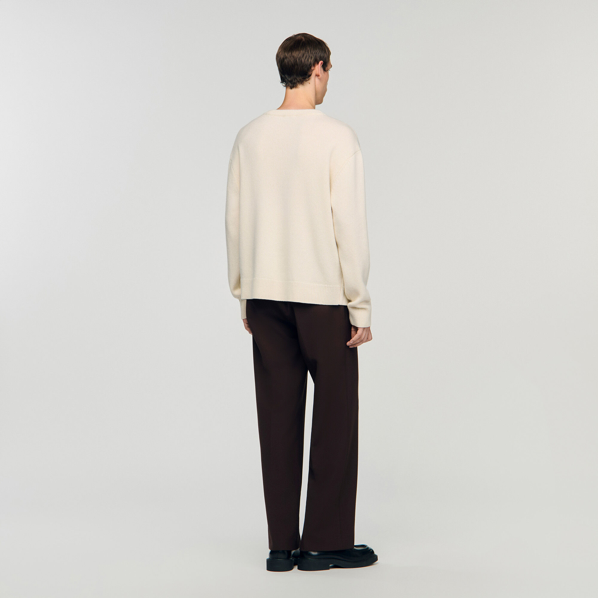 Pull en laine à détail fleur