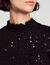Top orné de sequins